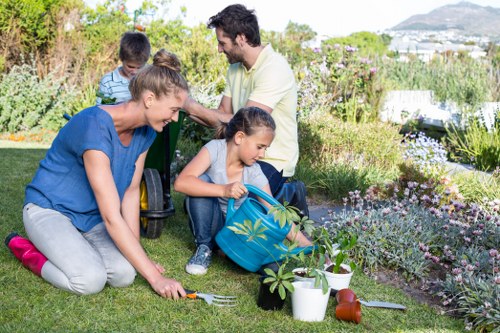 Family-friendly Raynes Park garden with patio, greenery, and structured layout